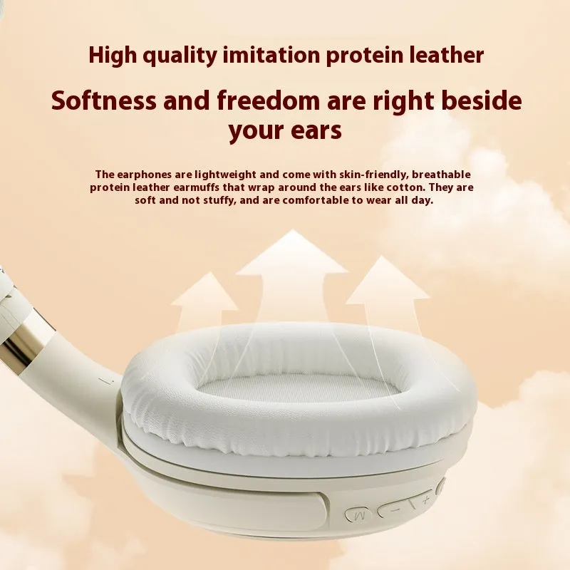 Cream coloured wireless Bluetooth over-ear gaming headset with microphone on a black background.