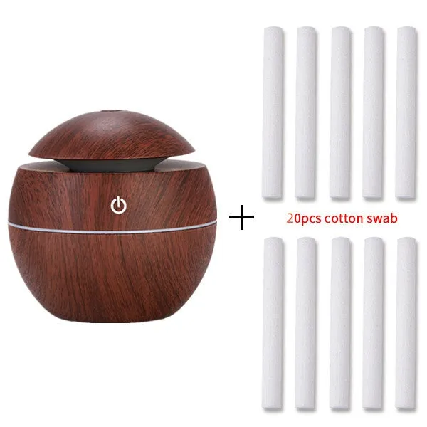 Mini USB aroma diffuser humidifier with wood grain finish, one fog outlet, and mechanical controls on a white background