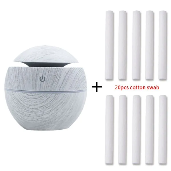 Mini USB aroma diffuser humidifier with wood grain finish, one fog outlet, and mechanical controls on a white background