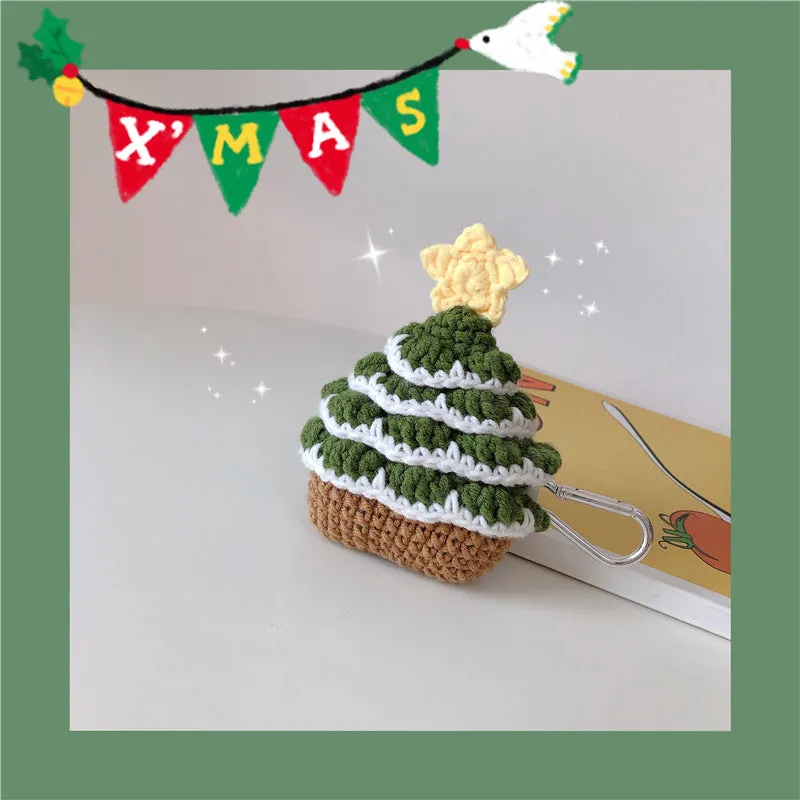 Green knitted Christmas tree flip-style headset case for AirPods with silver hook on white background