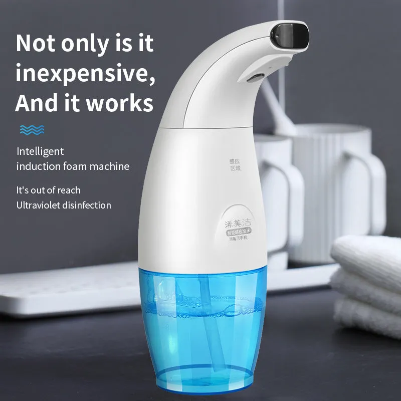 White intelligent induction foam machine on countertop with hand under nozzle dispensing foam