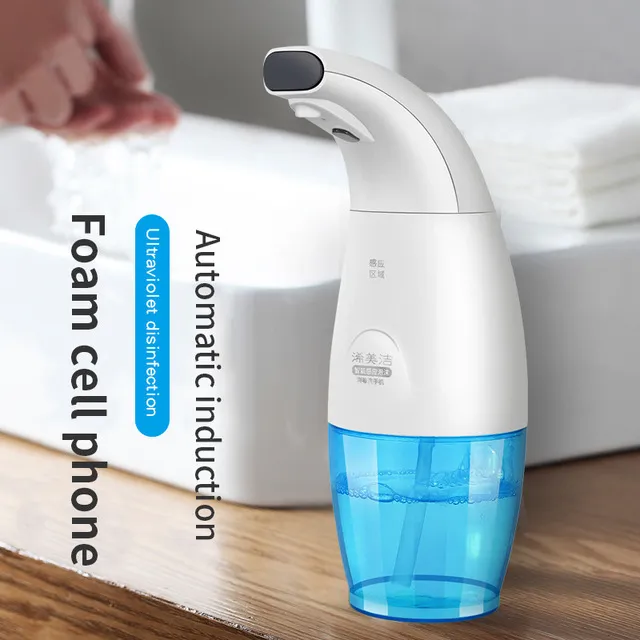 White intelligent induction foam machine on countertop with hand under nozzle dispensing foam