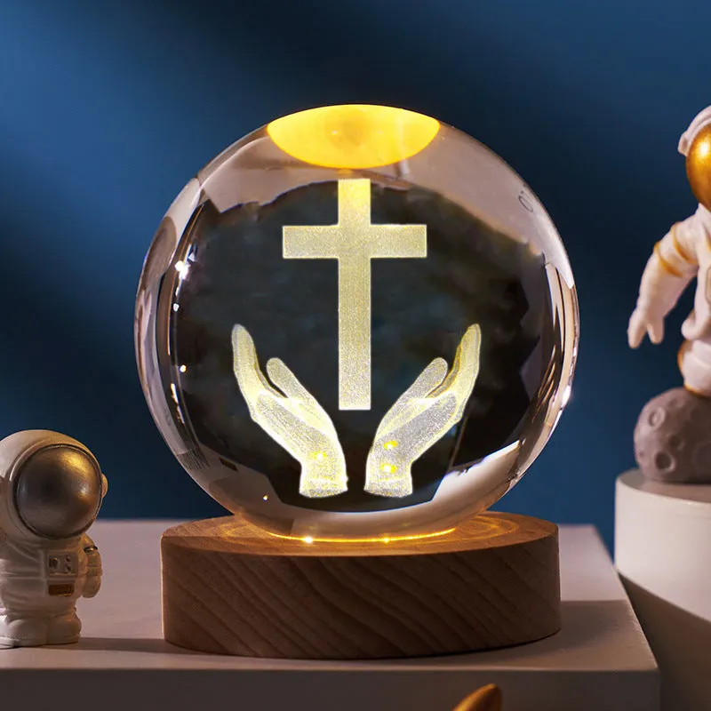 6cm white crystal ball desk ornament with laser-engraved cross design on a solid wood warm light base.