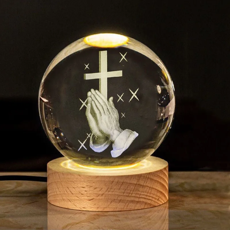6cm white crystal ball desk ornament with laser-engraved cross design on a solid wood warm light base.