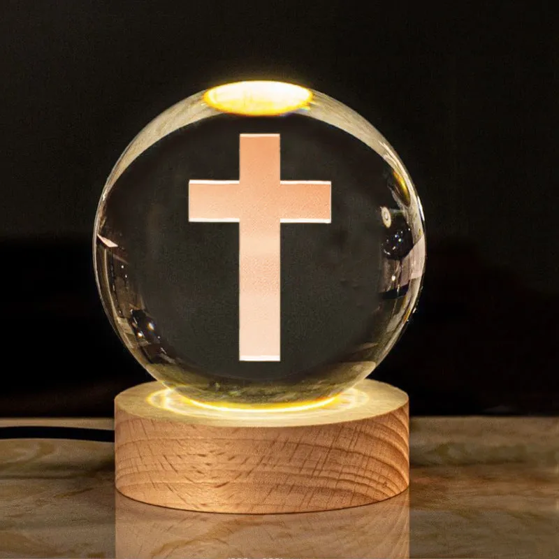 6cm white crystal ball desk ornament with laser-engraved cross design on a solid wood warm light base.