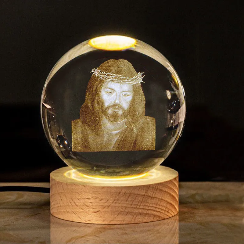 6cm white crystal ball desk ornament with laser-engraved cross design on a solid wood warm light base.