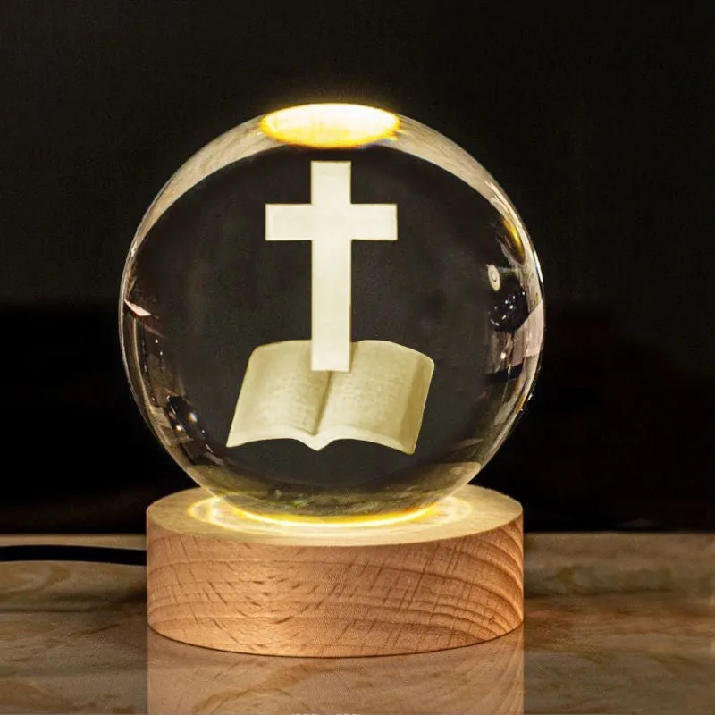 6cm white crystal ball desk ornament with laser-engraved cross design on a solid wood warm light base.