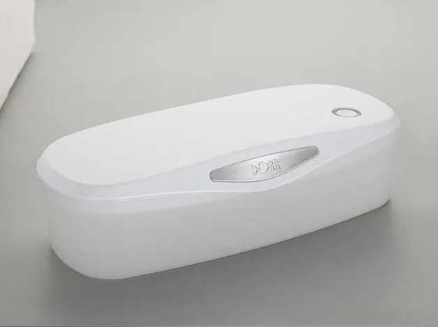 Compact white DORR UV disinfection box with USB cable for sanitising phones and small items.