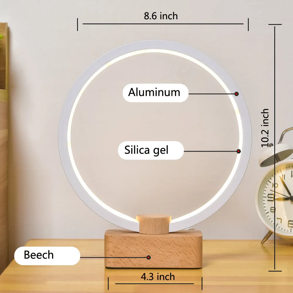 Round small solid wood and bamboo USB-powered LED night lamp on a table.