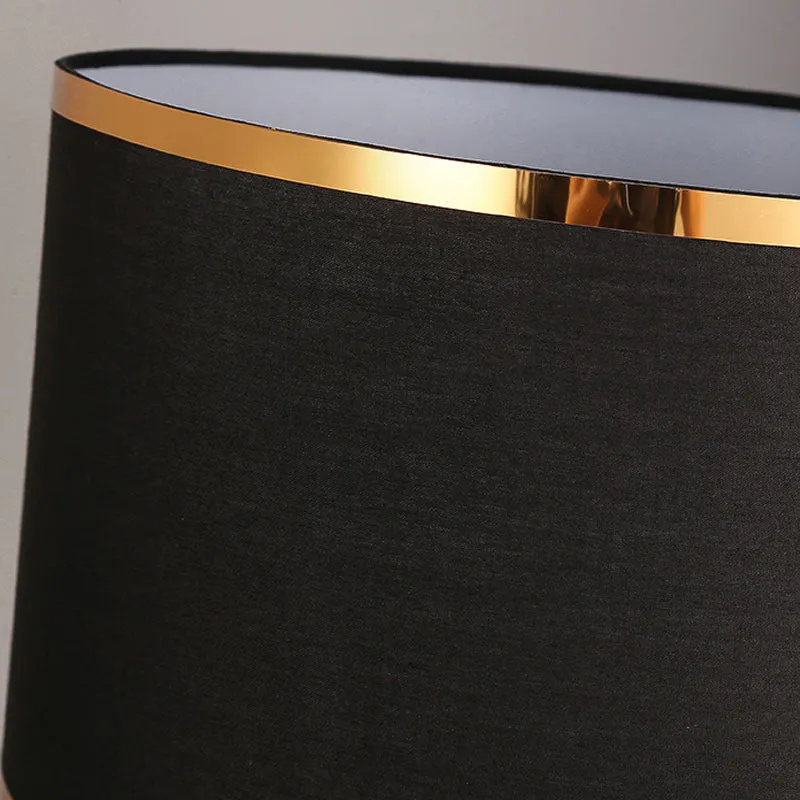Desk lamp with iron base and fabric shade in choice of black, gold or white colours