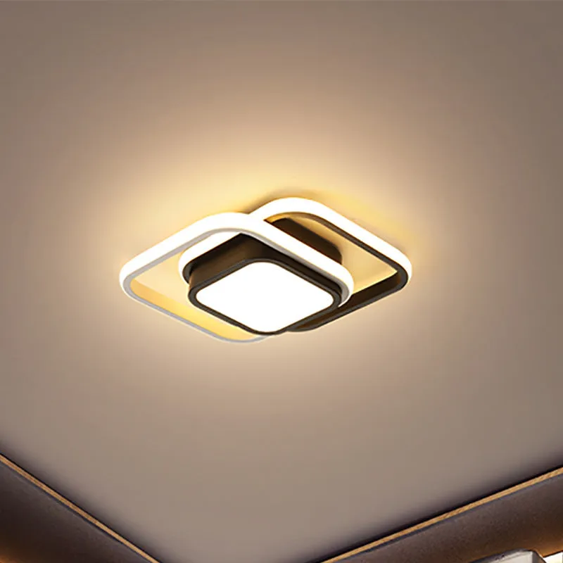 Modern round aluminium ceiling light with integrated LEDs, shown illuminating an entrance hall.