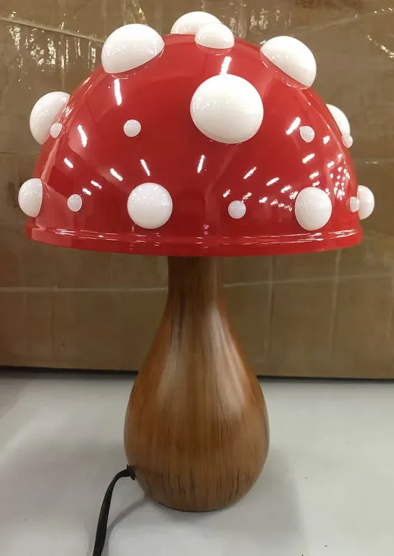 Modern mushroom-shaped table lamp with a touch dimming base on a wooden surface.