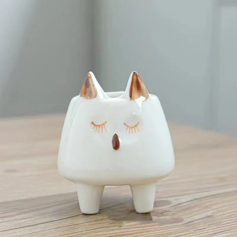 Hand painted ceramic succulent flowerpot with cartoon animal design in pastoral style.