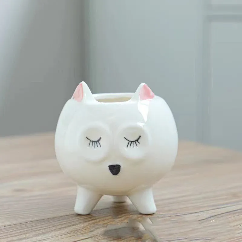 Hand painted ceramic succulent flowerpot with cartoon animal design in pastoral style.