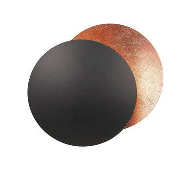 Round solar eclipse design wall lamp with iron construction in black and brass finish