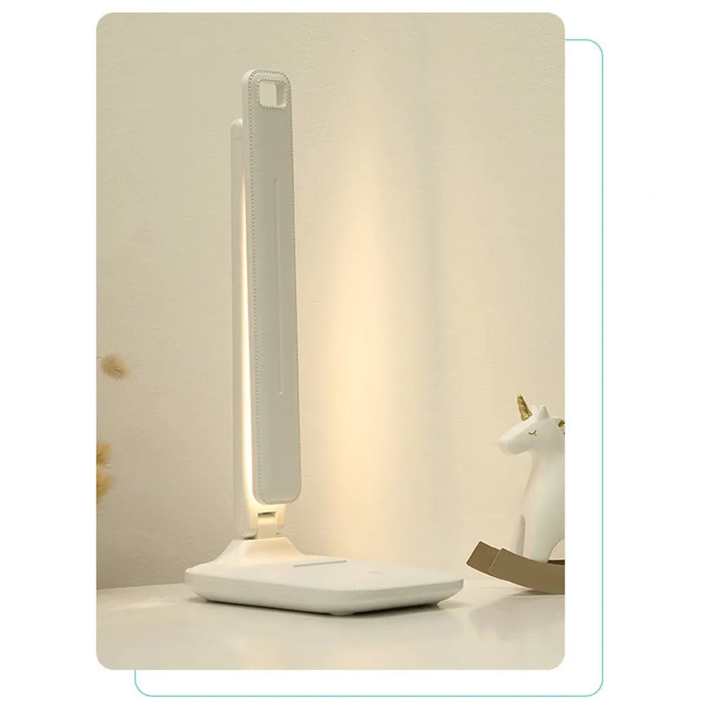 White plastic touch dimming bedside lamp with USB charging port.