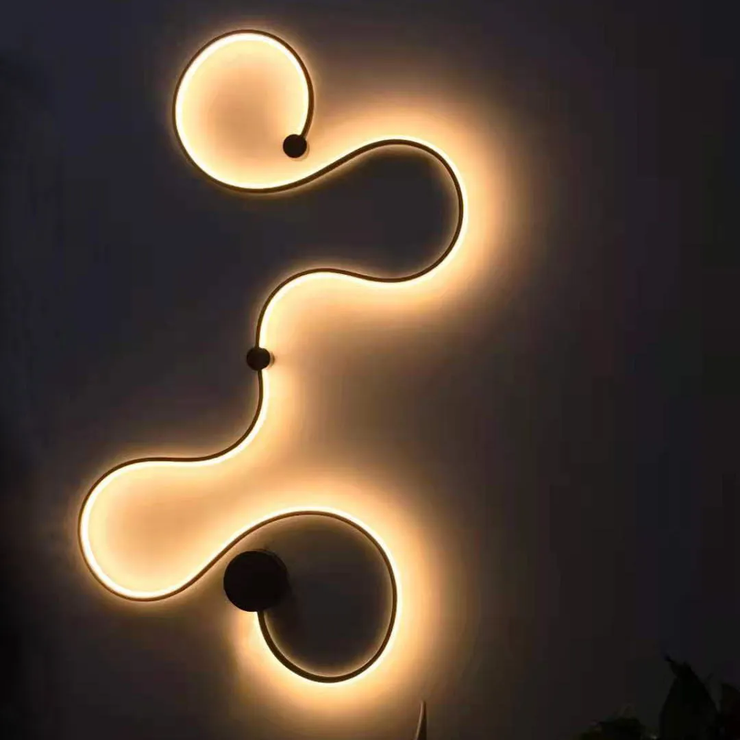 Black and white aluminium shade LED wall lamp in small, medium, large, and plus sizes