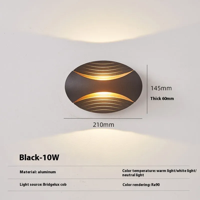 Modern minimalist aluminium wall lamp with IP65 rating, shown in black gold finish.
