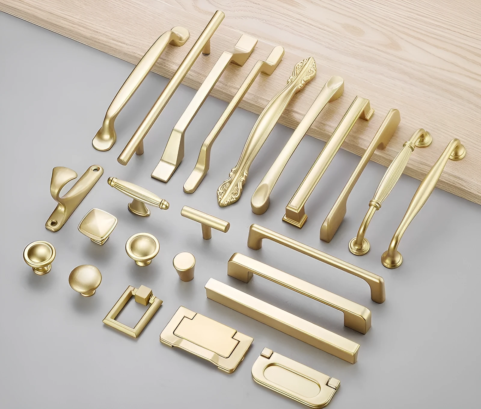 Gold aluminium alloy T-shape cabinet door handle with single-hole fitting.