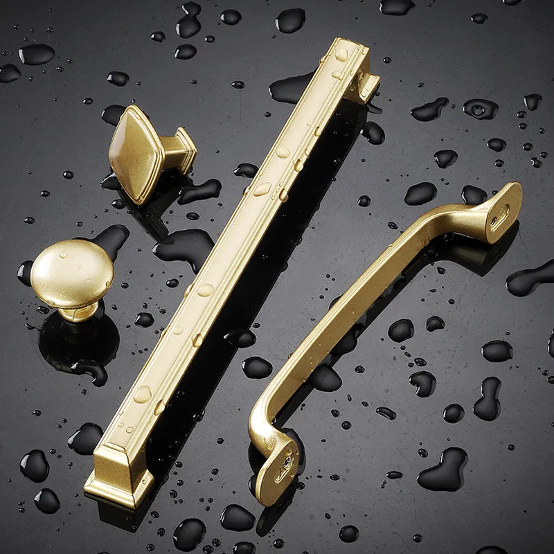 Gold aluminium alloy T-shape cabinet door handle with single-hole fitting.
