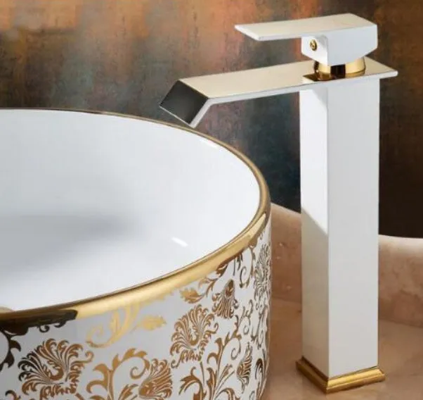 Black and white gold finished brass waterfall basin faucet with electric induction sensor.
