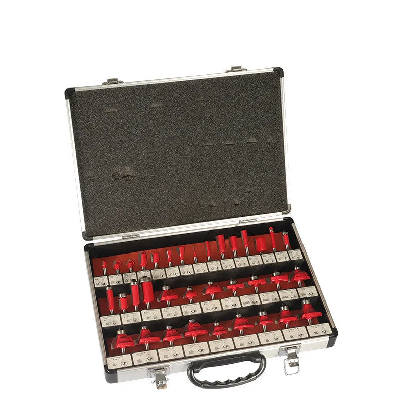 A set of 35 metal woodworking milling cutters and side cutters with different coloured handles on a workbench.
