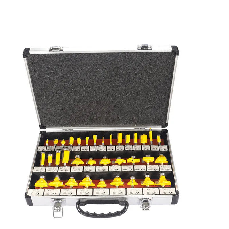 A set of 35 metal woodworking milling cutters and side cutters with different coloured handles on a workbench.