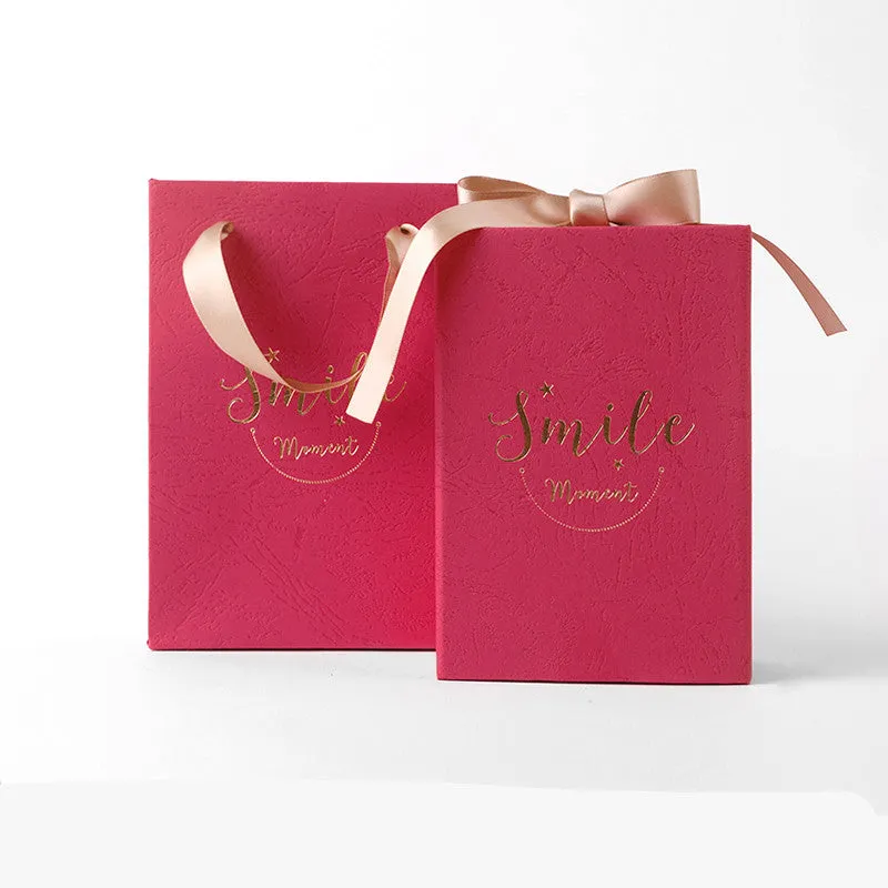 Small hard cardboard gift box with bronzing detail in blue, pink, red, and white colour options