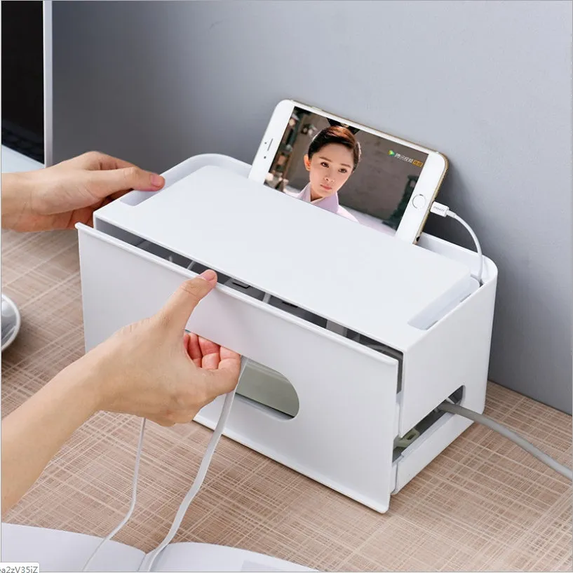 Gray and white plastic wireless router storage box with cable management compartments
