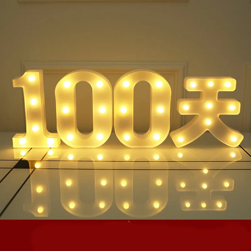 Plastic LED letter light decoration spelling a message, 22cm in height.