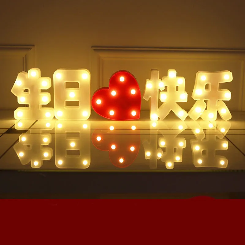Plastic LED letter light decoration spelling a message, 22cm in height.
