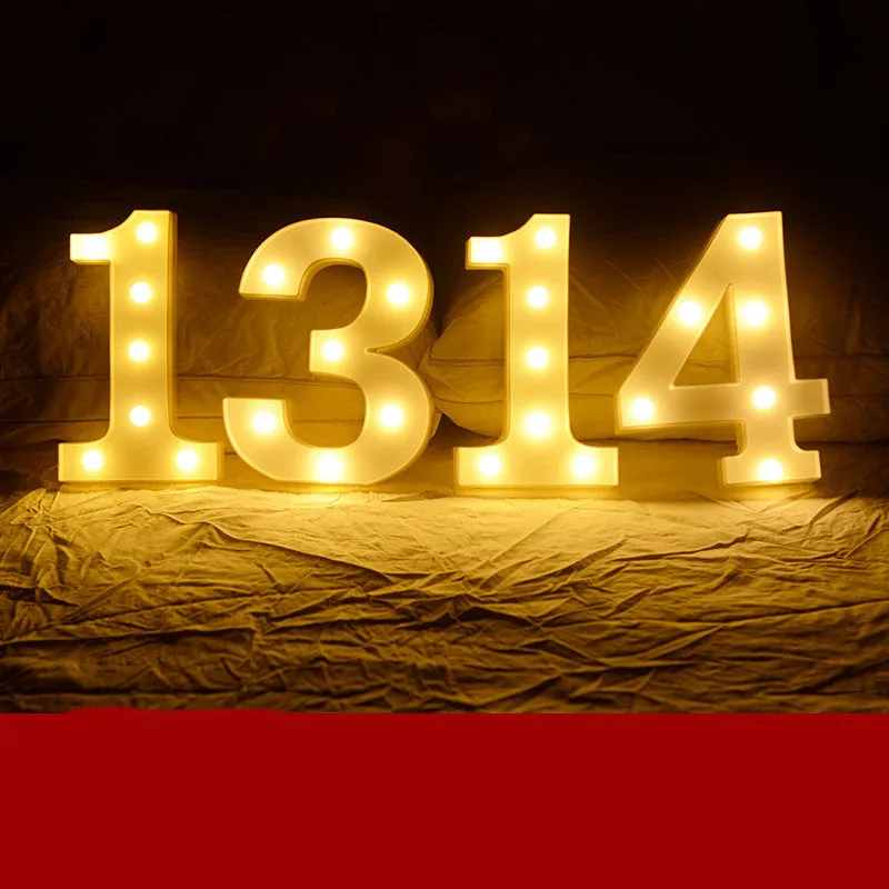 Plastic LED letter light decoration spelling a message, 22cm in height.