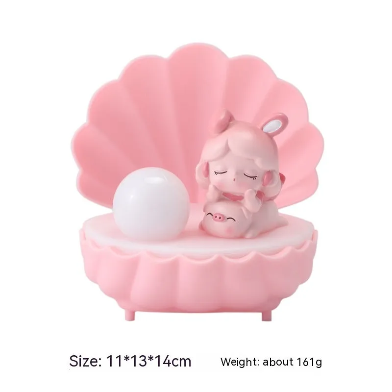 Cartoon character resin night light with shell star design on tabletop
