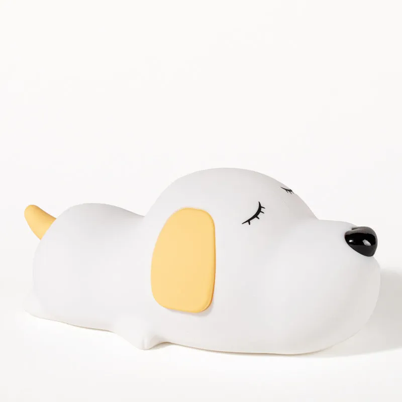 Silicone cartoon dog night lamp in two colours with a USB charging cable.