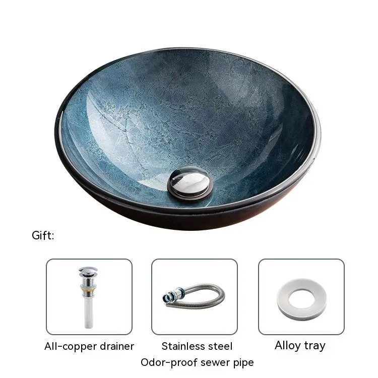 Blue grey coloured tempered glass bathroom table basin with simple art design on a countertop.