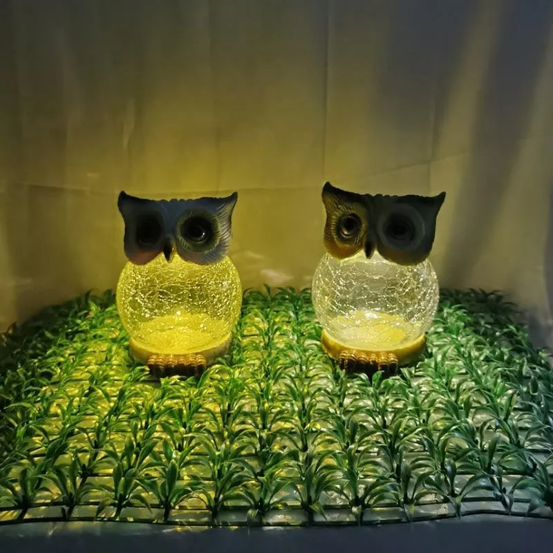 White solar owl garden light with LED illumination for outdoor pathways