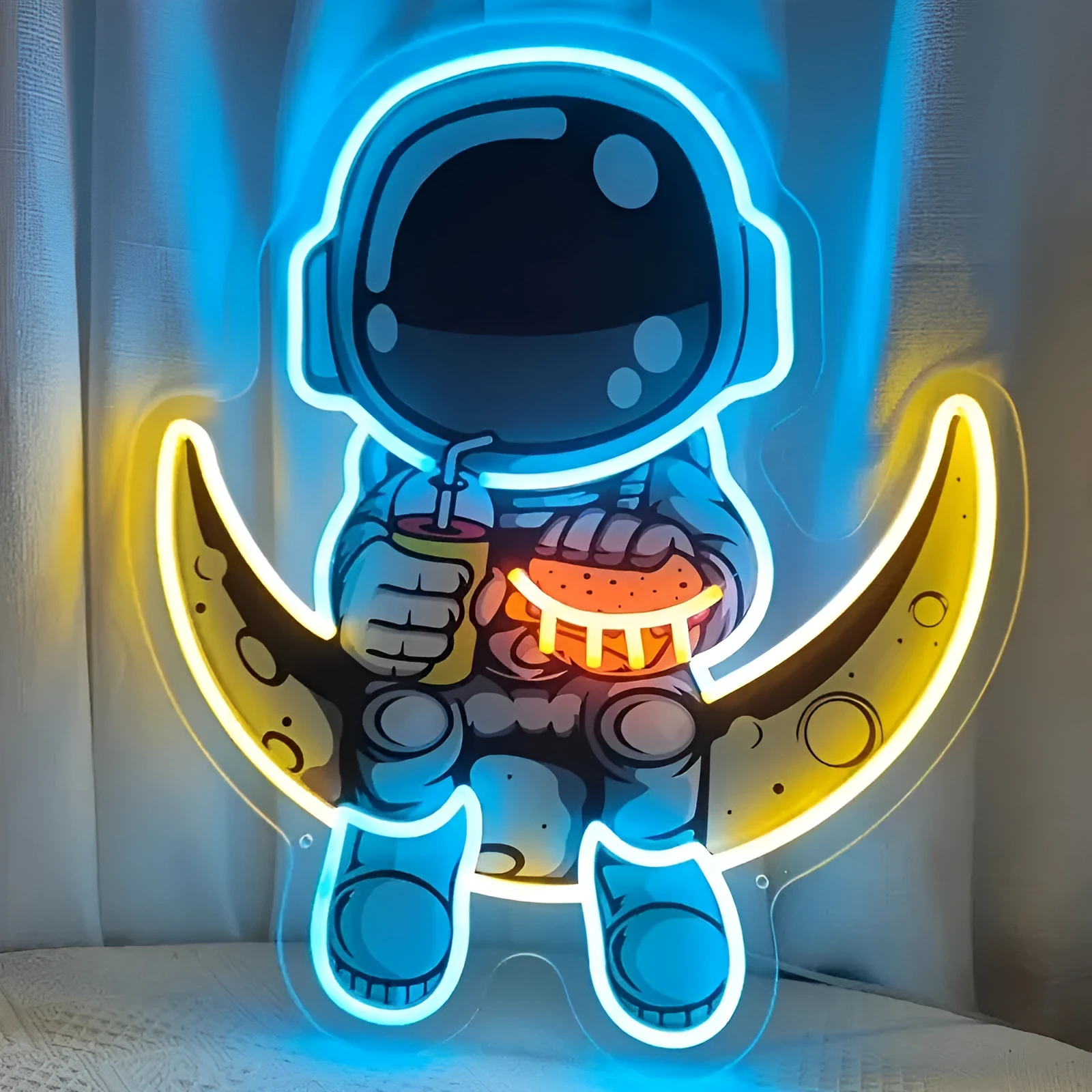 Astronaut-shaped wall-mounted neon light with USB power cord in blue or white colour options