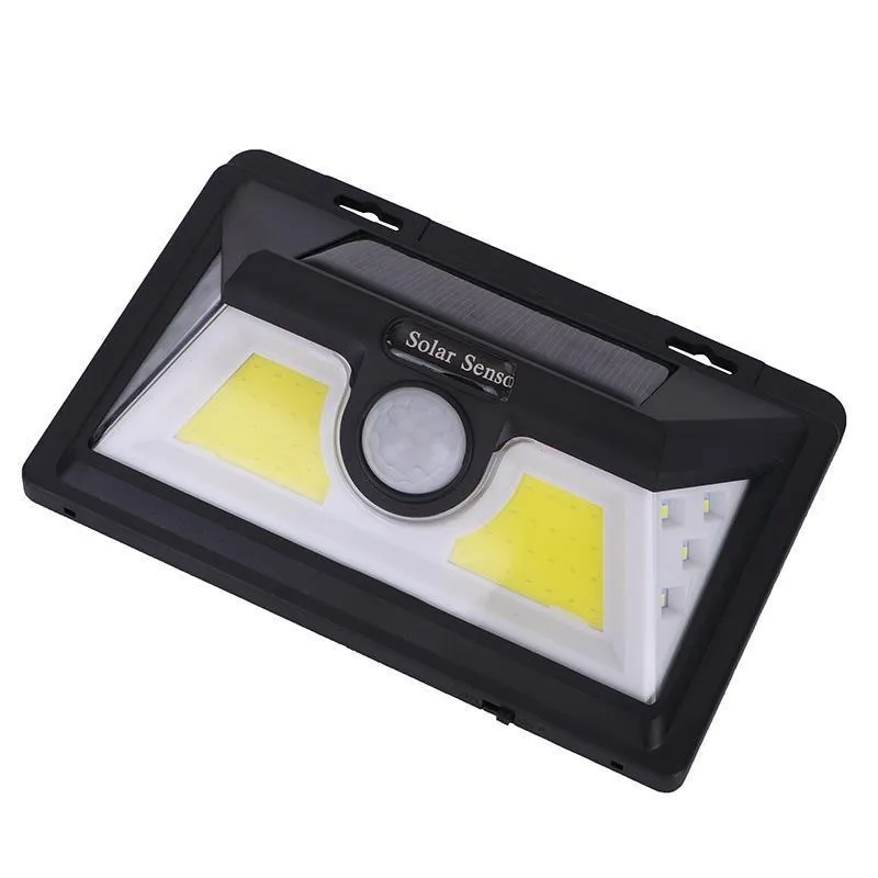 Solar outdoor garden lamp with LED lights and motion sensor in garden setting