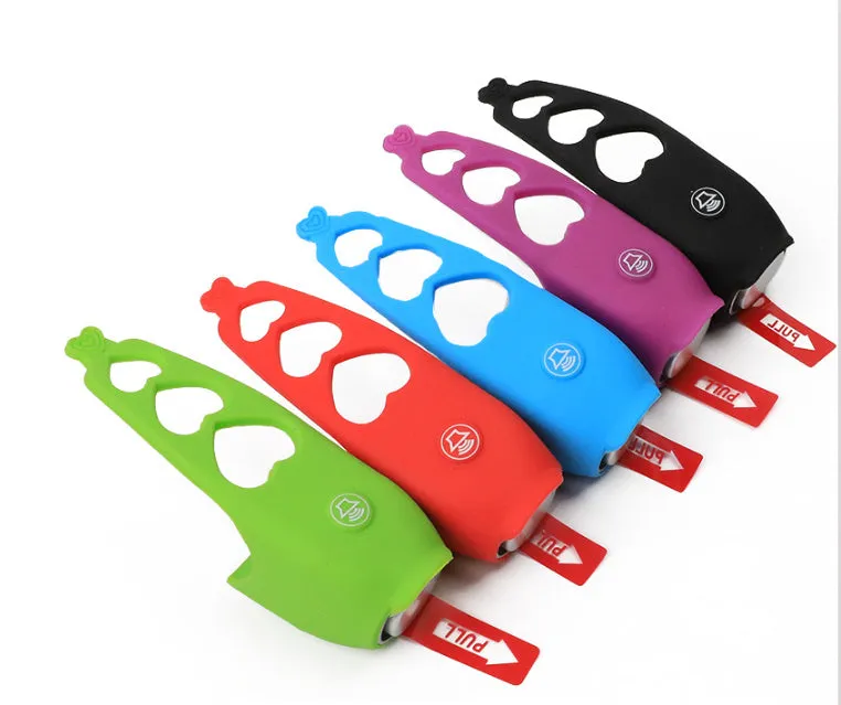 A plastic bicycle electronic horn in a choice of colours, showing handlebar mounting and two button cell batteries.