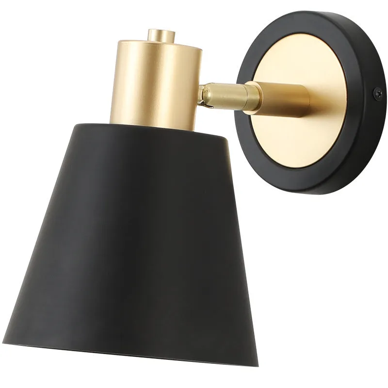 Nordic style iron wall lamp mounted on a wall, showcasing its welded shade design.
