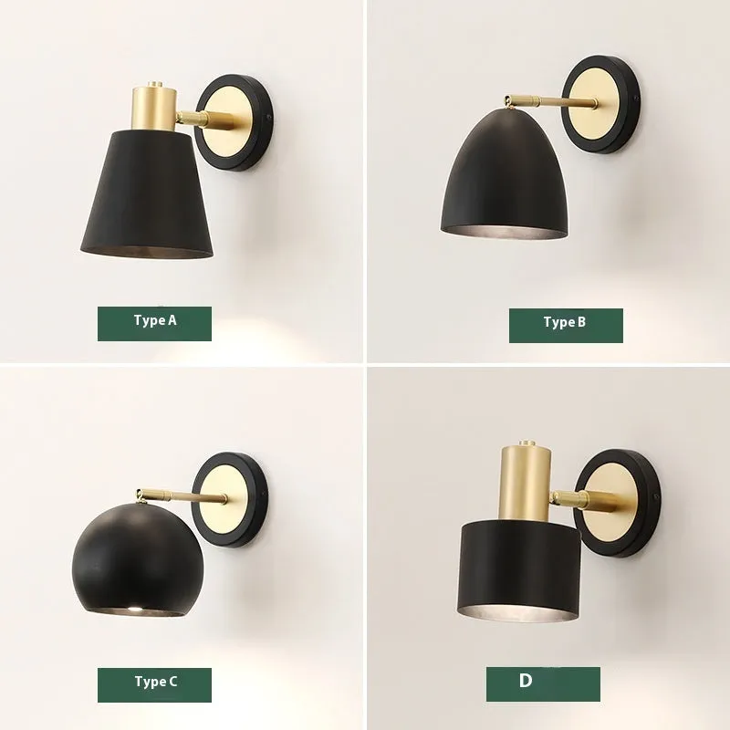 Nordic style iron wall lamp mounted on a wall, showcasing its welded shade design.