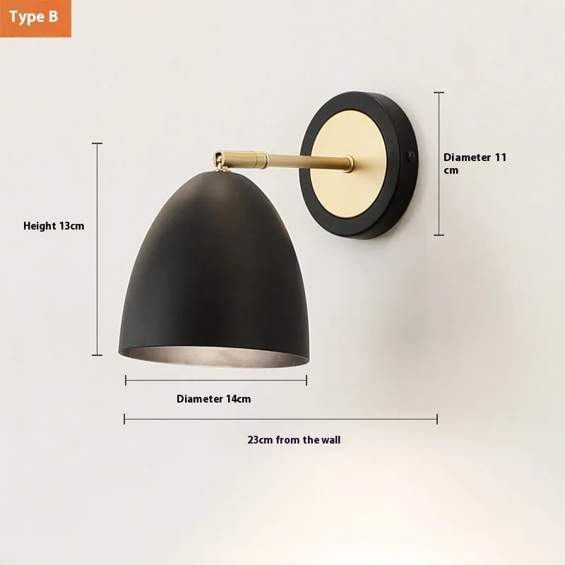 Nordic style iron wall lamp mounted on a wall, showcasing its welded shade design.