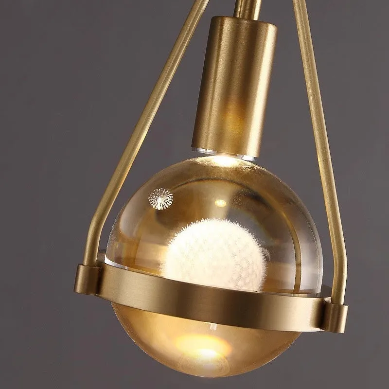 Modern copper and crystal chandelier with multiple light heads in a minimalist design.