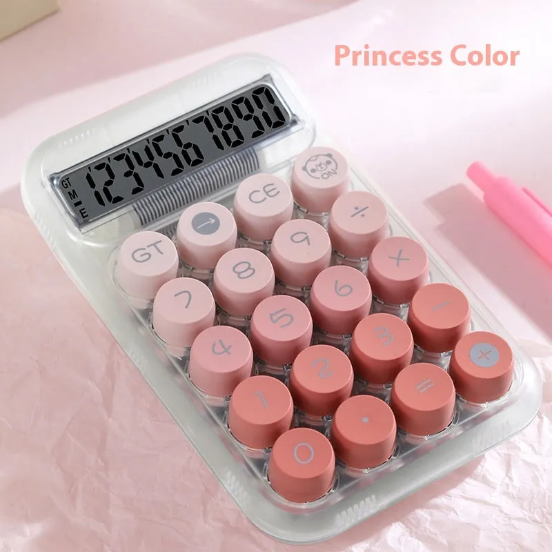 Keyboard-style gradient colour calculator in mute blue, green, pink, or purple on a desk.