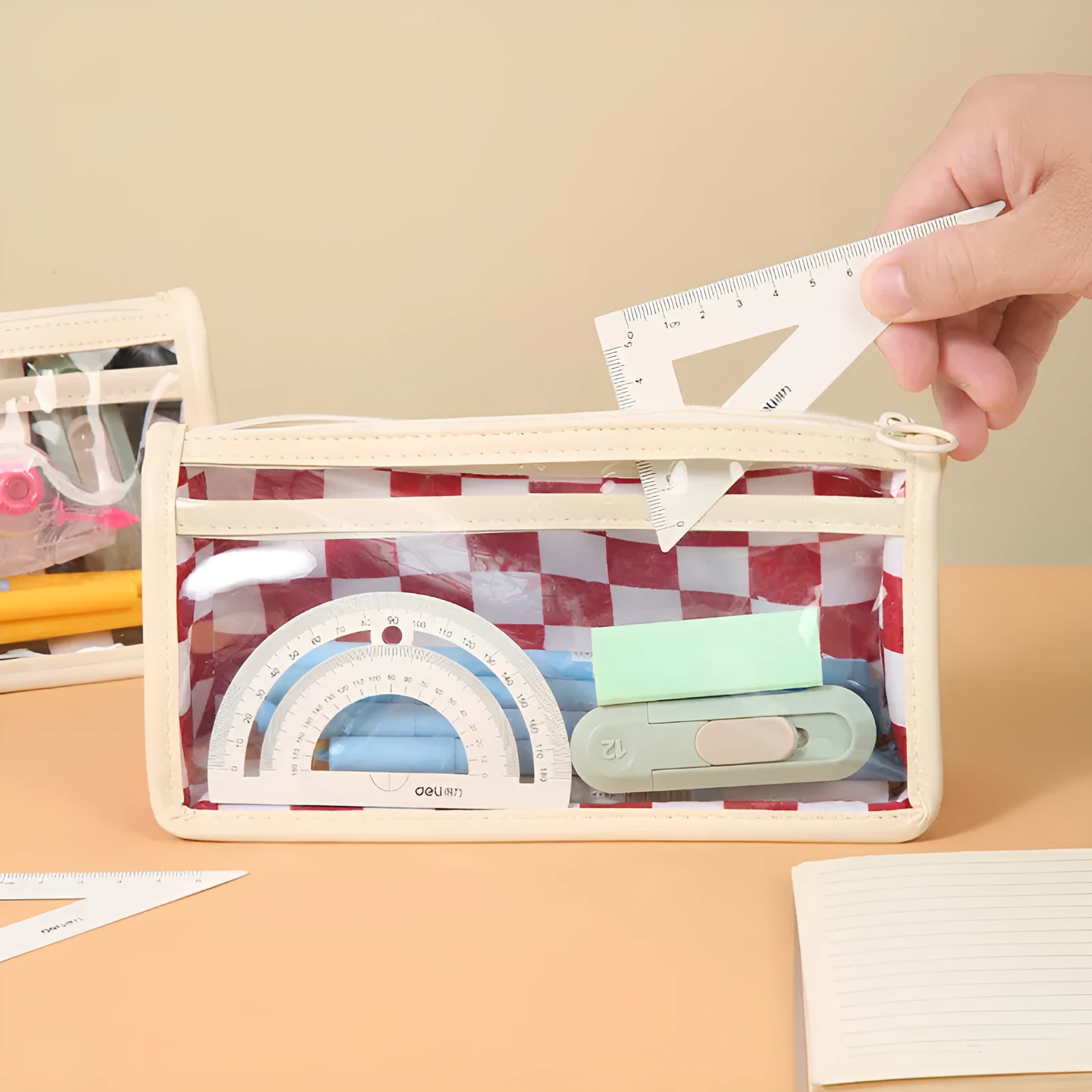 Large transparent PVC pencil case with chessboard grid pattern in black and white plaid.