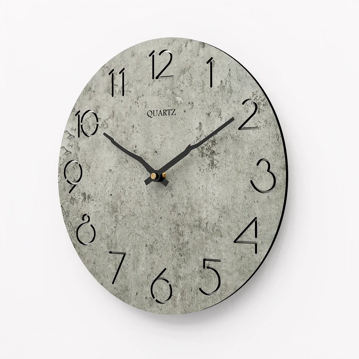 Modern grey European-style wall clock with a round face on a white wall.