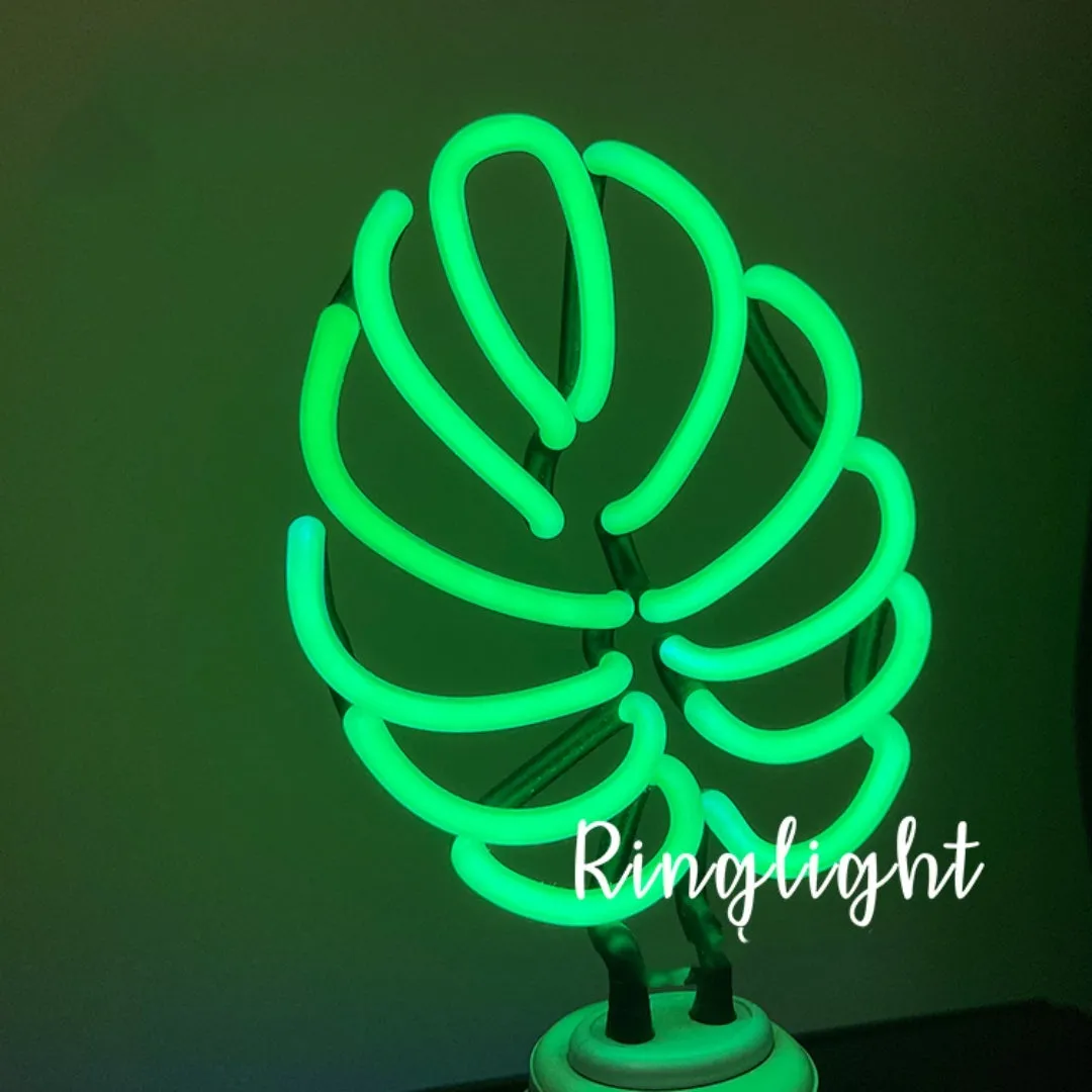 Minimalist bamboo-shaped desktop lamp with USB cable and green illumination