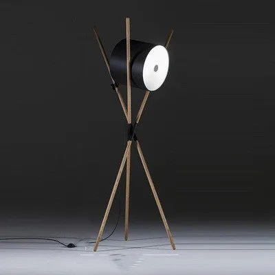 Modern wooden three-fork LED floor lamp with white acrylic shade in a living room setting.