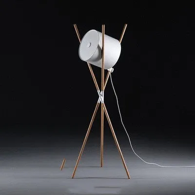 Modern wooden three-fork LED floor lamp with white acrylic shade in a living room setting.