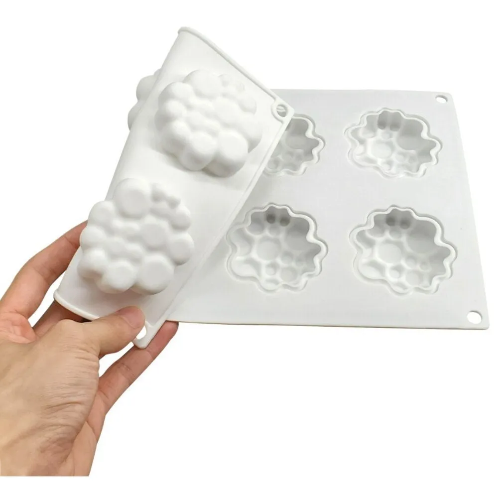 Round silicone baking mould with eight bubble indentations for cakes and desserts